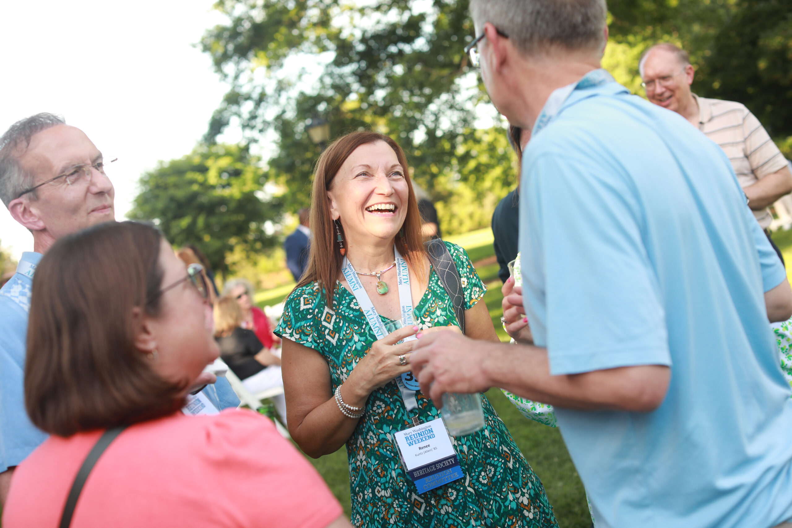Renee Kuntz '85 (center, chatting with friends at Reunion Weekend in 2022) recently made a pledge that helped UMW's Beyond the Classroom Endowment pass the $1 million mark to help Mary Washington students engage in high-impact learning experiences like study abroad, internships, and undergraduate research. Photo by Karen Pearlman.