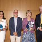 2024 Alumni Award recipients Simran Kaur-Colbert '11, Susan Leavitt '83, and Jay Dugger '90 with President Troy Paino at UMW's Alumni Awards ceremony on June 1 during Reunion Weekend. Photo by Karen Pearlman.