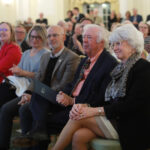 From left: Vice President for Advancement and Alumni Engagement Katie Turcotte, Kelly Paino, President Troy Paino, Distinguished Professor Emeritus Bill Crawley, and Dr. Terrie Young Crawley '77 listen as Scott Harris '83 announced the new Great Lives season on Tuesday. Photo by Karen Pearlman.