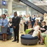 SSI students, faculty members, administrators, alumni, and other guests listen as College of Arts and Sciences Dean Keith Mellinger acknowledges Irene Piscopo Rodgers '59 and her transformational $30 million gift. Photo by Karen Pearlman.