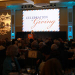 Vice President for Advancement and Alumni Engagement Katie Turcotte quoted late chef and globetrotting TV host Anthony Bourdain as she welcomed donors to the 2024 Celebration of Giving, held in the Cedric Rucker University Center's Chandler Ballroom. Photo by Karen Pearlman.