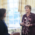 Adelaide Gill ’25 (left) converses with Lori Foster Turley '81 at the Washington and Alvey Scholars reception. Photo by Karen Pearlman Photography.