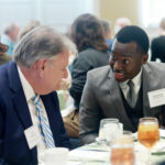 Aloysious, who received the Thomas Howard and Elizabeth Merchent Tardy Scholarship, among others, chats during last year's Scholarship Luncheon with his donor, Al Merchent. Photo by Karen Pearlman.