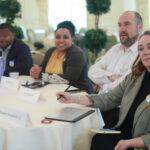 From left: Alumni Board members Harry Thomas '97, Lisa Maloney Keyser '05, and Brian Reagan '04 and Young Alumni Council Chair Lauren Rainford '15 listen to the presentations. Photo by Karen Pearlman.