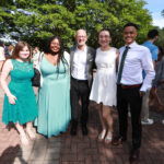 Students pose with President Paino in the Jepson Alumni Executive Center courtyard. Photo by Karen Pearlman.