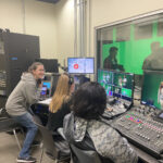 From left: Audra Young, Mariah Misch, and Pearl Lee prepare to broadcast an episode of 'Are We Live?' from the Charnoff Production Studio, using the older technology that had been in place since the HCC opened in 2014. The new broadcast panel increases functionality, Cartland said, giving students access to cutting-edge tools that were not available with the previous technology. Photo courtesy of Cartland Berge.
