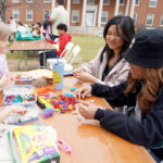 Hazel Lam-Mackintosh and Harper Thaden (left) make bead bracelets with UMW students Jenny Vuong and Boramy Meng at last year's Multicultural Fair. Challenges and matches during Mary Wash Giving Day will help ensure favorite campus events - and other Mary Washington traditions - continue. #MaryWashDay #TogetherUMW