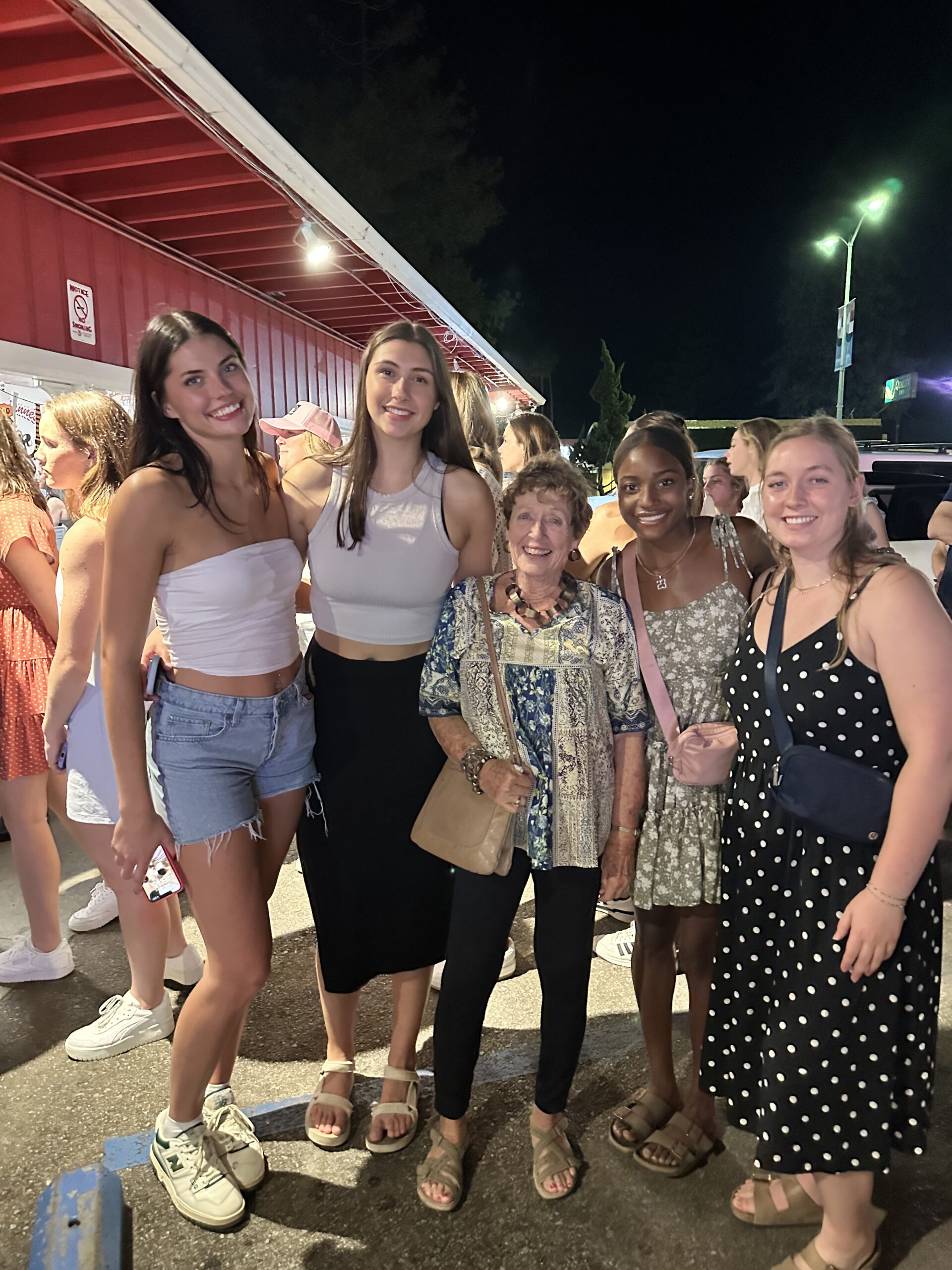 Ruth Ann became close to Abby's friends, roommates, and teammates. She even flew out to see the UMW women's volleyball team compete in California. From left: Emma Hadley '24, Marie Butler '24, Ruth Ann Foiles Brunet '62, Jordan Lyons '24, and Abby Tank '24. Photo courtesy of Abby Tank and Ruth Ann Foiles Burnet.