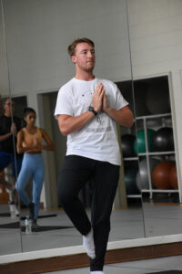 Fifth-year student Kevin Dougherty says that the fitness center's expanded hours mean that more people are able to attend the yoga classes he teaches.