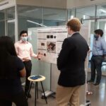 Rising senior Kevin Leong, a physics major, presented his poster detailing how he created a solar-powered cell phone charging station for the homeless with Assistant Professor Desmond Villalba. Photo credit: UMW's Summer Science Institute.