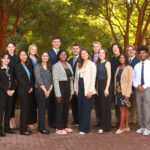Aloysious (front row, right) and other members of the Student Alumni Ambassadors (SAA) pose for a photo outside the Jepson Alumni Executive Center. Photo courtesy of Cadiann Treviño Pinto.