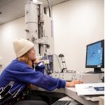 Student Kristine Dadufelza works in UMW’s Jepson Science Center with the electron microscope gifted to the University by Irene Piscopo Rodgers. Photo by Tom Rothenberg.