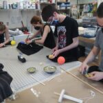 Matthew Monaghan, Alex Anthes Rojas, Cameron Hovey and Ben Lechtman collaborate on a tabletop puppet production. #MaryWashDay #TogetherUMW