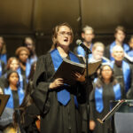 Sofia rehearses with UMW's combined choirs. Receiving a full-ride Alvey Scholarship gave her the chance to minor in music and neuroscience, in addition to her psychology major, and perform with the UMW choirs and UMW Theatre. Photo by Tom Rothenberg.