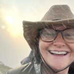 Sally smiles during a rainstorm in Africa. Photo courtesy of Sally Brannan Hurt.