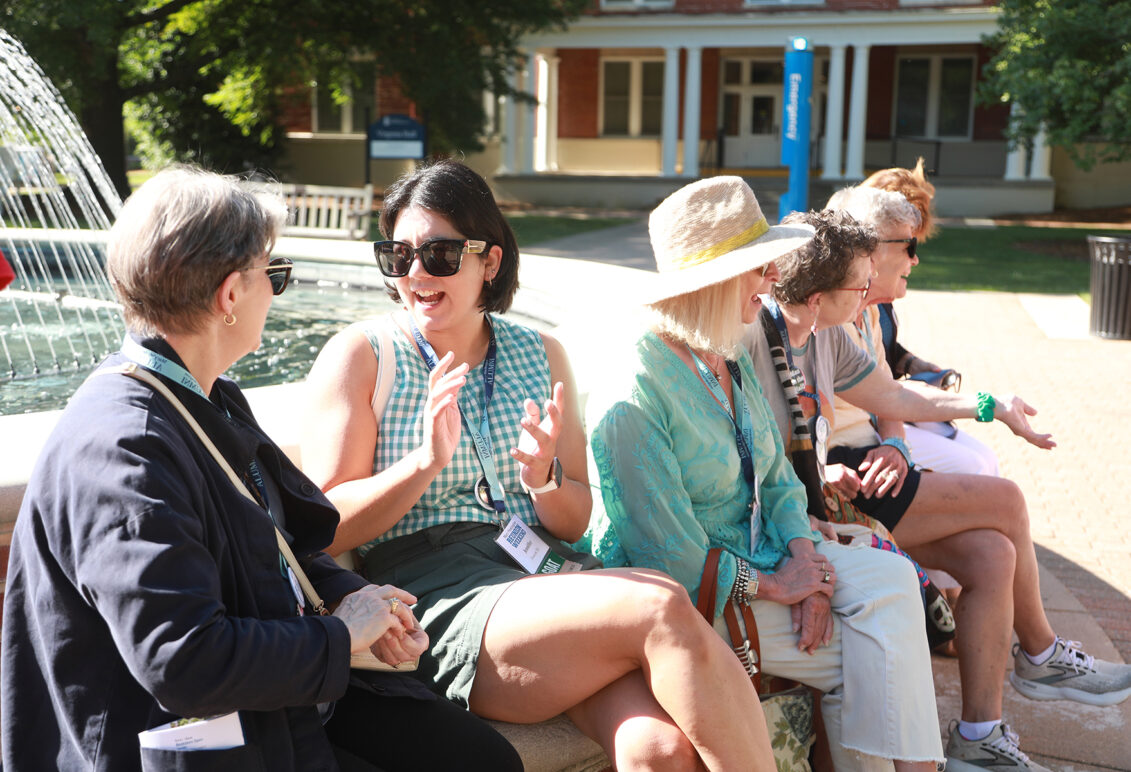 Alumni sit for a spell at the fountain on Palmieri Plaza in front of Monroe Hall, one of the most popular spots on the UMW campus. Photo by Karen Pearlman.