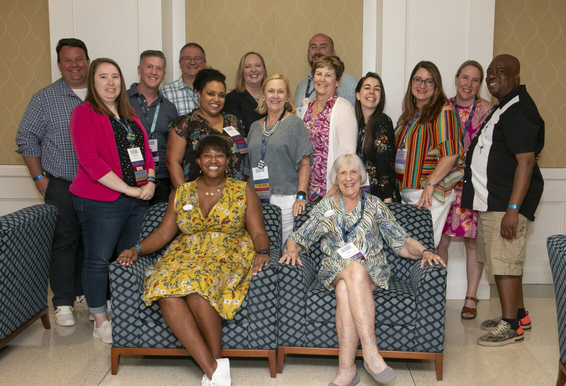 Past and present members of the Alumni Association Board of Directors pose for a photo with Executive Director of Alumni Engagement Mark Thaden ’02 (back row, far left) and Vice President for Advancement and Alumni Engagement and UMW Foundation Executive Director Katie Turcotte (back row, center left) at Reunion Weekend in 2024. Photo by Karen Pearlman.