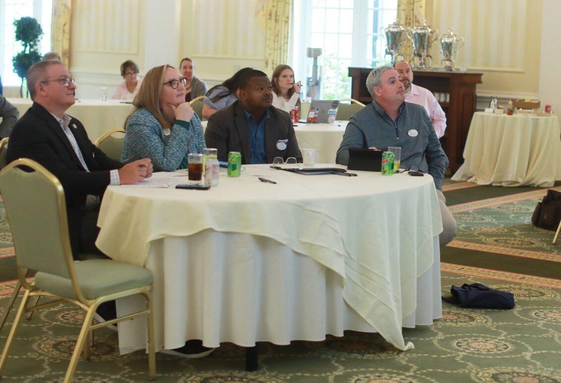 From left: Alumni Association Board of Directors President James Llewellyn '87, Vice President for Advancement and Alumni Engagement and UMW Foundation Executive Director Katie Turcotte, and Alumni Board members Harry Thomas '96 and Brendan Kelly '95 listen to presentations before awarding Fund for Mary Washington Impact Grants in April. Photo by Karen Pearlman.