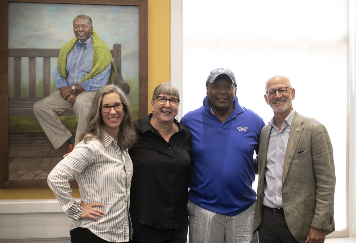 From left to right: Artist Nicole Horn poses with Professor Emerita of Art Carole Garmon, Dean of Student Life Emeritus Cedric Rucker '81, and UMW President Troy Paino after the unveiling of Cedric's portrait inside the Cedric Rucker University Center. The building was named for the longtime - and beloved - Mary Washington administrator. Photo by Karen Pearlman.
