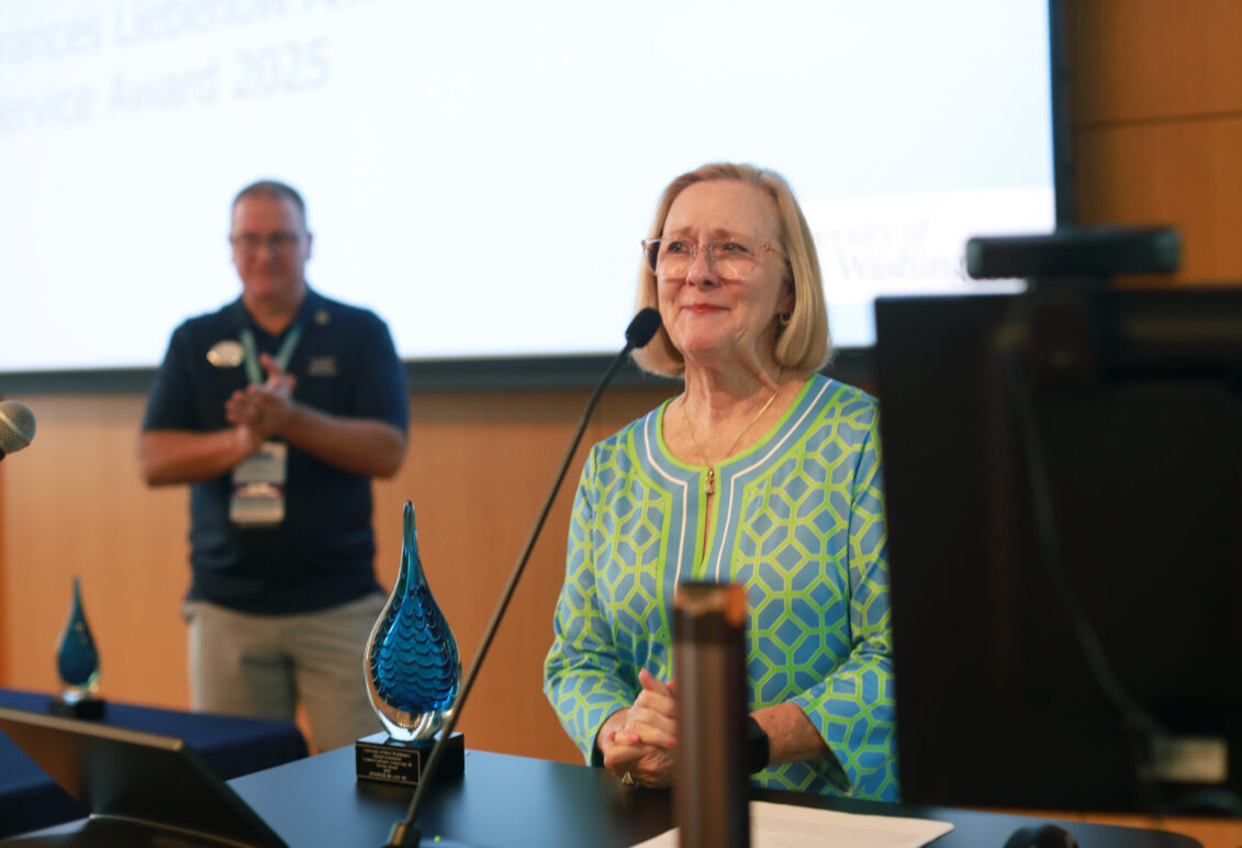 JB Blair '82, who has volunteered at Mary Washington for over 40 years, receives a standing ovation as AABOD President James Llewellyn '87 looks on. Photo by Karen Pearlman.