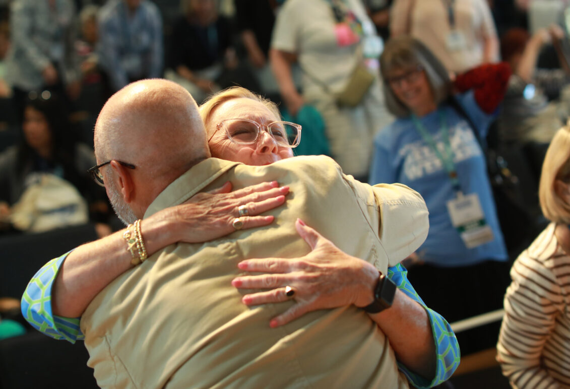 JB Blair '82 hugs President Troy Paino after receiving the Frances Liebenow Armstrong '36 Service Award. Photo by Karen Pearlman.