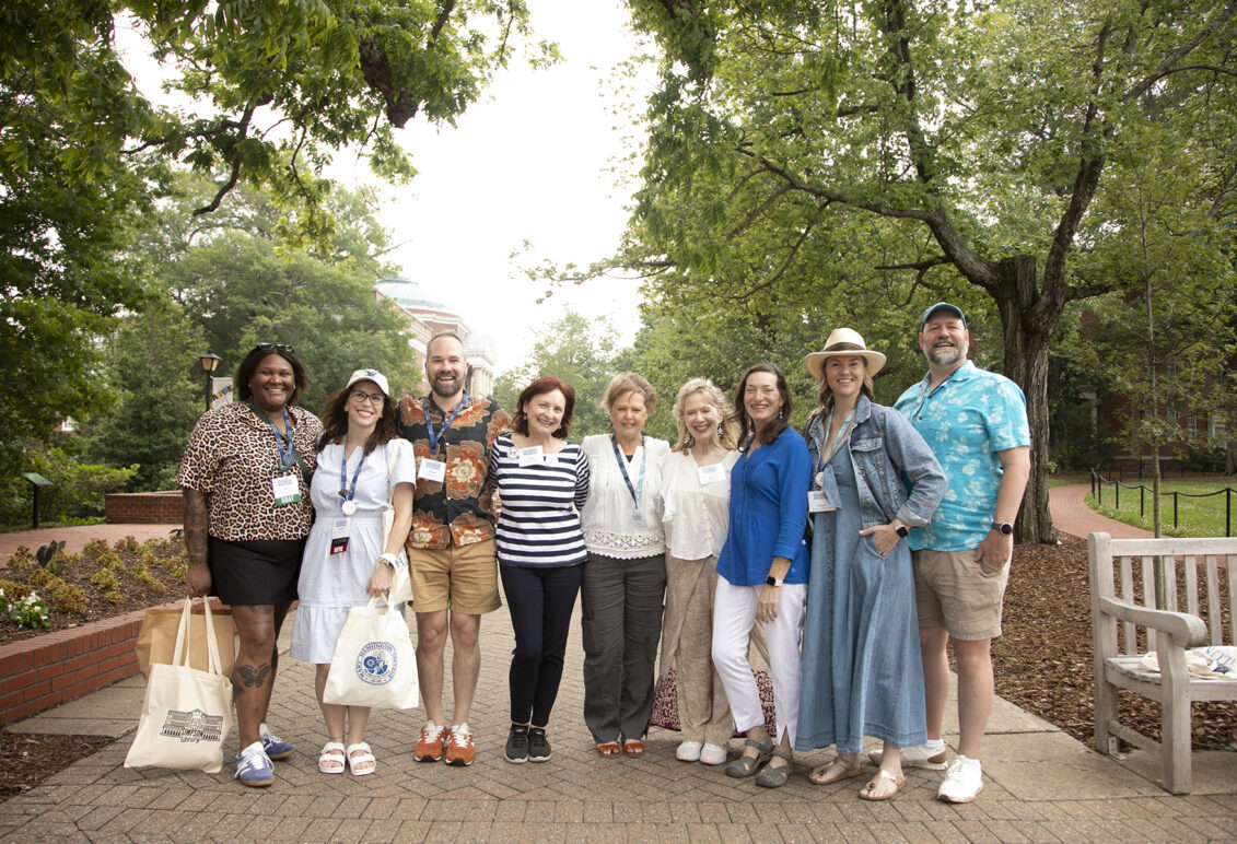 Rachel Selle '05 (second from left) and fellow 2005 alumni join 1980 alumni for a photo on Campus Walk during Reunion Weekend. This year's event celebrated classes ending in 0 and 5, but all graduates are welcome to participate in the annual celebration held at the end of May. Photo by Karen Pearlman.