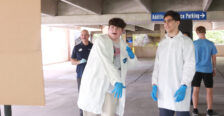 Tristan Towle (center), a junior at Brooke Point High School, chucks a painted cotton ball at the canvas, while Zubair Mohammadzai, a senior at Osbourn Park High School, and UMW Physics Chair and Professor Matt Fleenor watch. Photo by K Pearlman Photography.