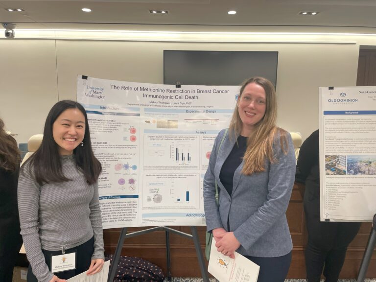 Mallory Thompson and her faculty mentor, Assistant Professor of Biological Sciences Laura Sipe, in front of their research poster at the Virginia State Capitol during a student showcase presented by the Network for Undergraduate Research in Virginia last spring.