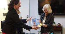 Dr. Juliette Landphair (left), associate vice president for health and well-being at Mary Washington, shows Betty Talley a copy of Princeton Review's 'The Best 391 Colleges' guide for 2026, which lists Mary Washington at #15 Best Student Support and Counseling Services. Photo by K Pearlman Photography.